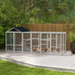 Gray chicken coop run with black roof, wire mesh sides and perches inside