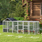 Gray chicken coop run with black roof, wire mesh fencing and perches for yard use