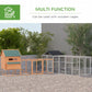 Chicken coop run shown in an outdoor setup, gray frame with black roof and mesh walls