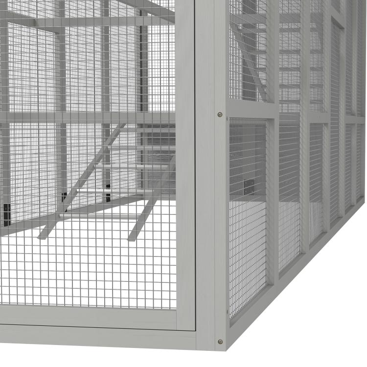 Close-up of gray chicken run door frame and wire mesh fencing on the side