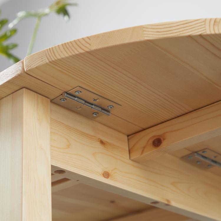 Natural wood drop-leaf kitchen table, hinge and support detail under tabletop