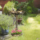 Bronze bird bath pedestal with shell basin, two bird statues, and circular planter tray