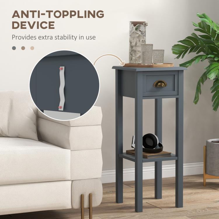 Gray side table with drawer and open lower shelf; steady frame design.