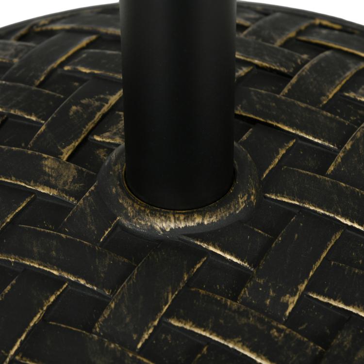 Close-up of umbrella base plate around pole base with woven texture