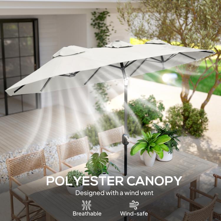 White patio umbrella canopy with vented fabric and central stand
