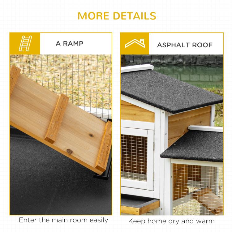 Wooden rabbit hutch showing ramp entry and textured black asphalt-style roof panels