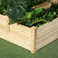 Close-up of natural wood three-tier planter box with lush green plants