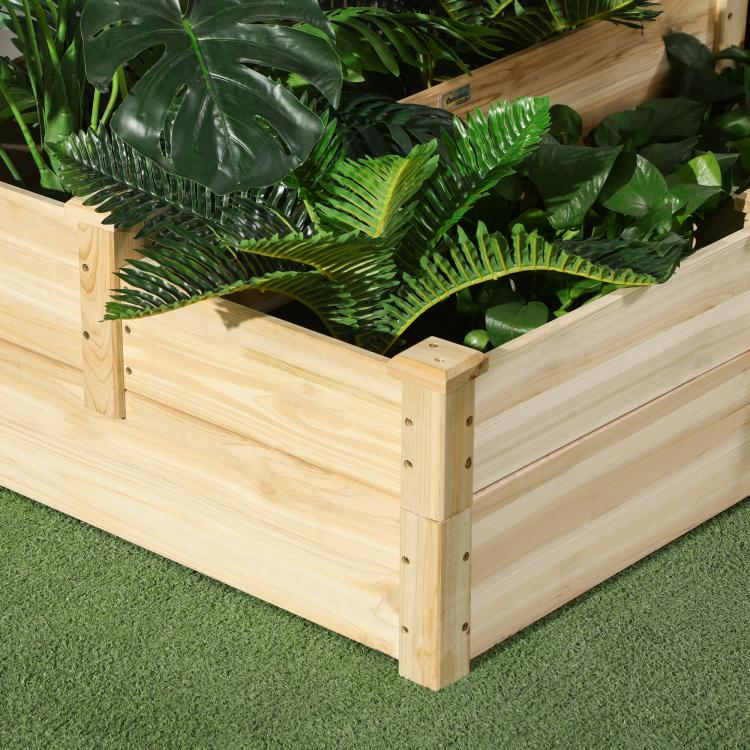Close-up of natural wood three-tier planter box with lush green plants