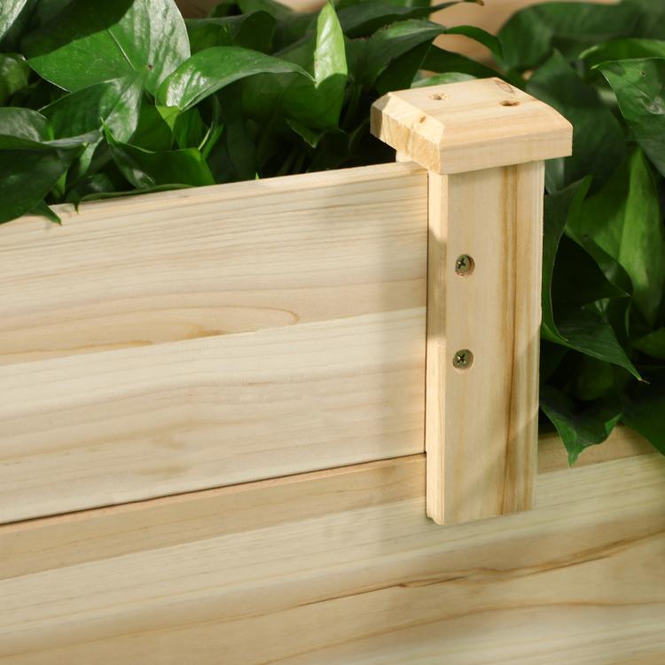 Close-up corner of natural wood three-tier planter box with sturdy post and screws