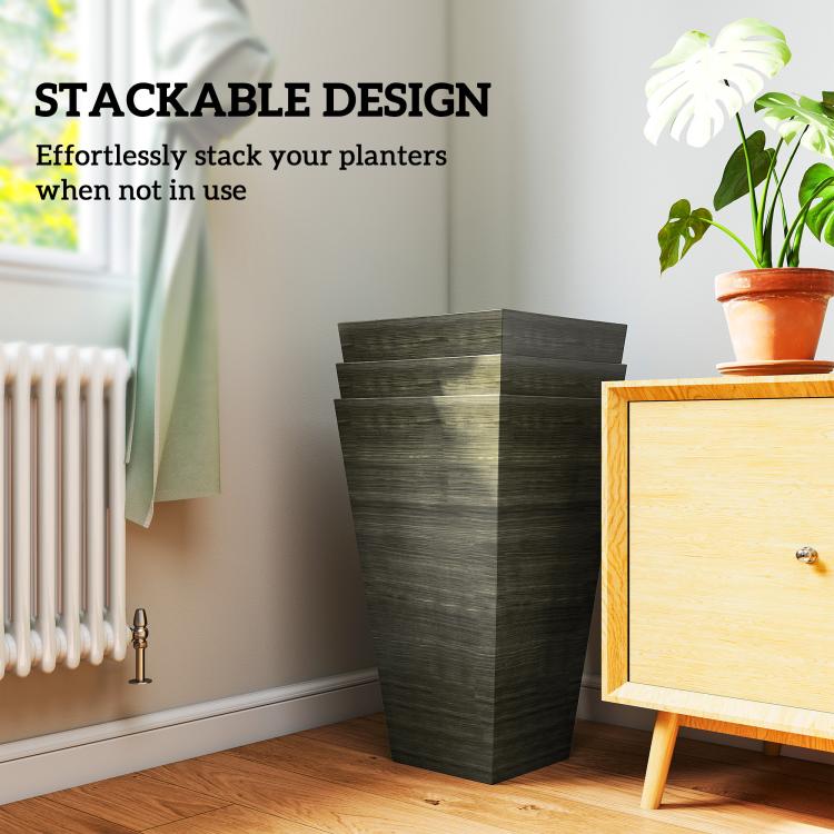 Stackable tall dark brown wood-look plastic planters near a window
