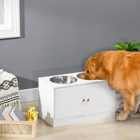 White raised dog feeding stand with two stainless steel bowls and enclosed storage doors