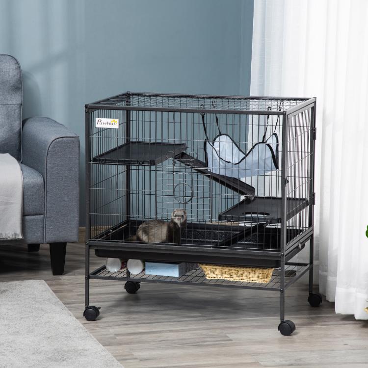 Black wire small animal cage with ramp and blue hammock, interior platforms