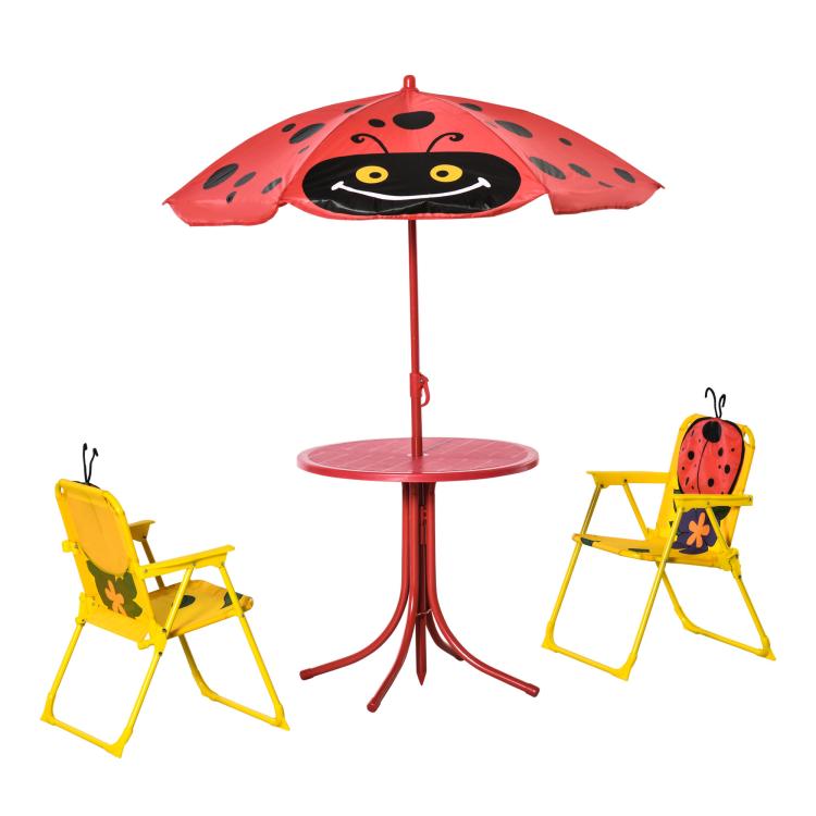 Red ladybug kids umbrella with round table top and two yellow folding chairs, side view