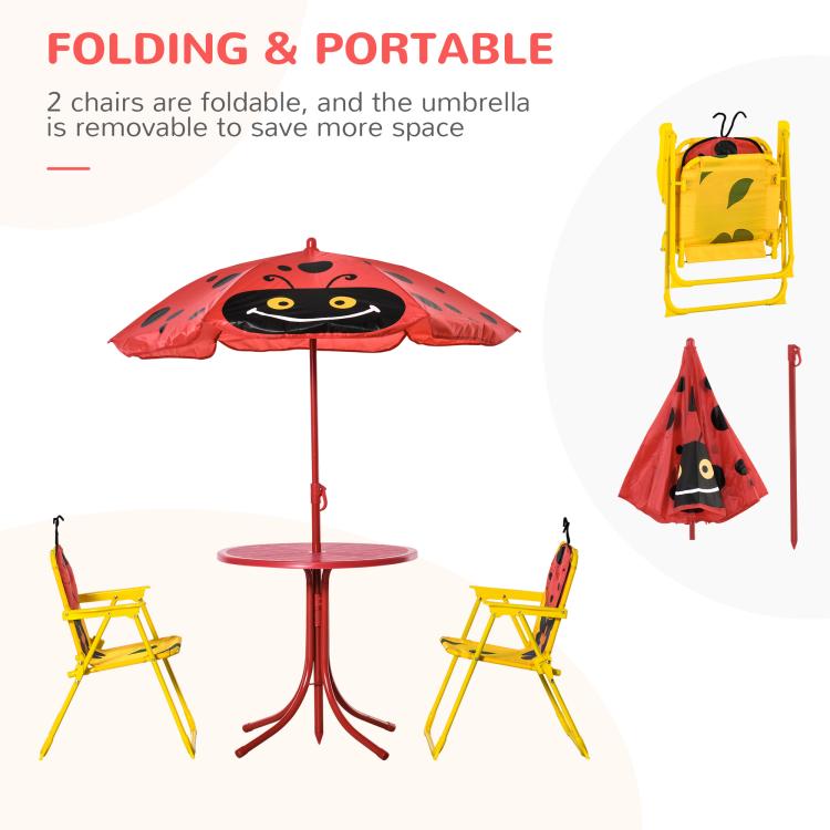 Folding kids table and two yellow folding chairs with red ladybug umbrella canopy