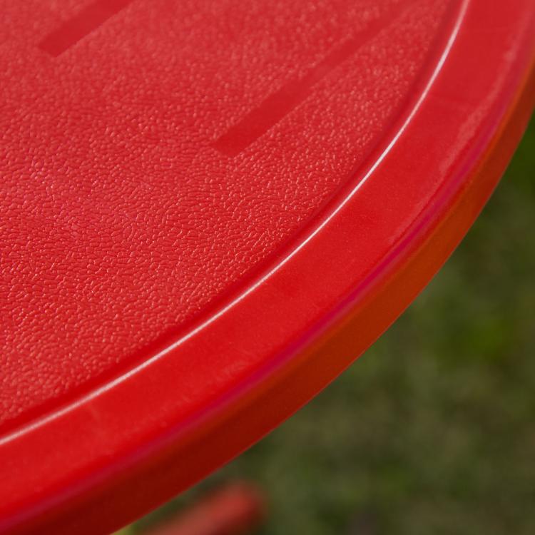 Close-up of red umbrella edge with textured fabric finish