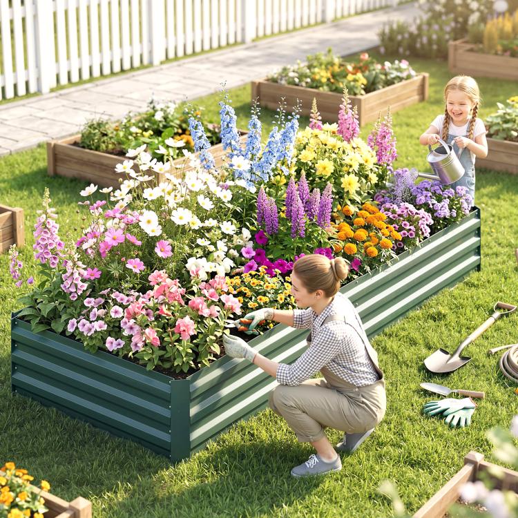 Green raised garden bed with dense colorful flower border along the side