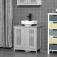 Grey bathroom vanity storage cabinet with two slatted doors and raised sink base.