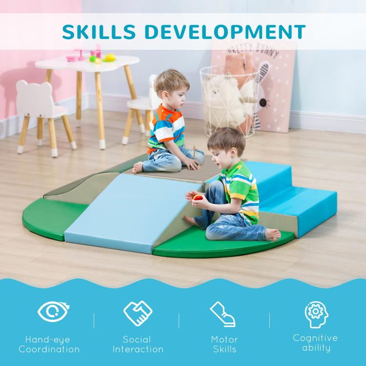 Foam climbing blocks with blue and green platforms, child sitting and playing