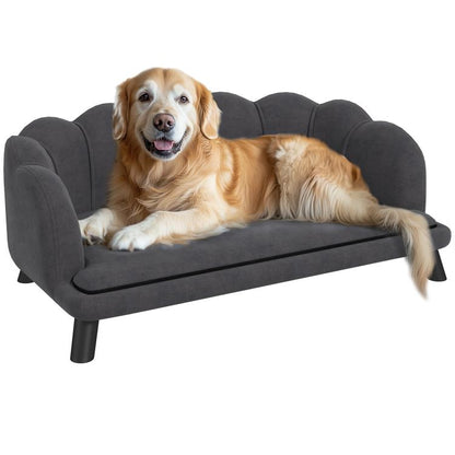 Charcoal gray pet sofa with cushioned seat and solid wood legs, dog resting