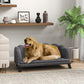Charcoal gray pet sofa with cushion and armrests, dog lying on the seat