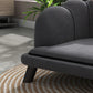 Charcoal gray pet sofa close-up of rounded armrest and cushioned seat