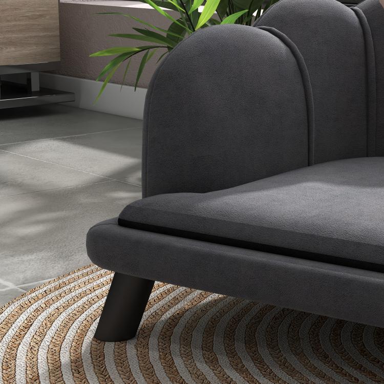 Charcoal gray pet sofa close-up of rounded armrest and cushioned seat
