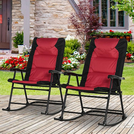 Two outdoor rocking chairs with red padded cushions and black metal frames