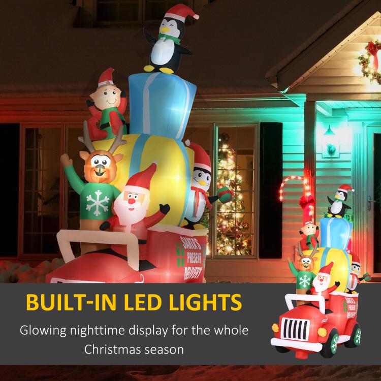 Inflatable Santa gift car with built-in LED lights and penguin top figure