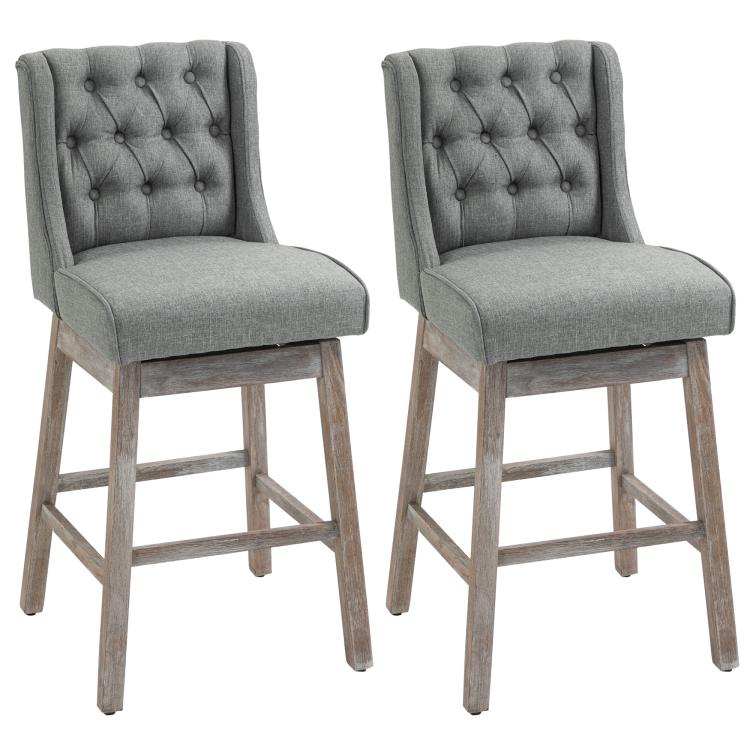 Set of 2 gray upholstered bar stools with button-tufted backs and solid wood legs