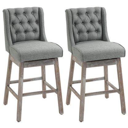 Set of 2 gray upholstered bar stools with button-tufted backs and solid wood legs
