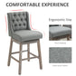 Gray tufted bar stool with padded seat and buttoned backrest, shown with detail insert