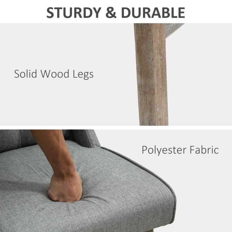 Gray bar stool with solid wood legs and upholstered seat cushion