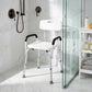 Bath shower chair with white seat and backrest and black curved armrests