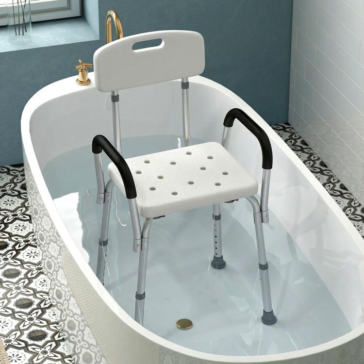 Shower chair for bathtub with white seat and backrest, black armrests, and adjustable legs