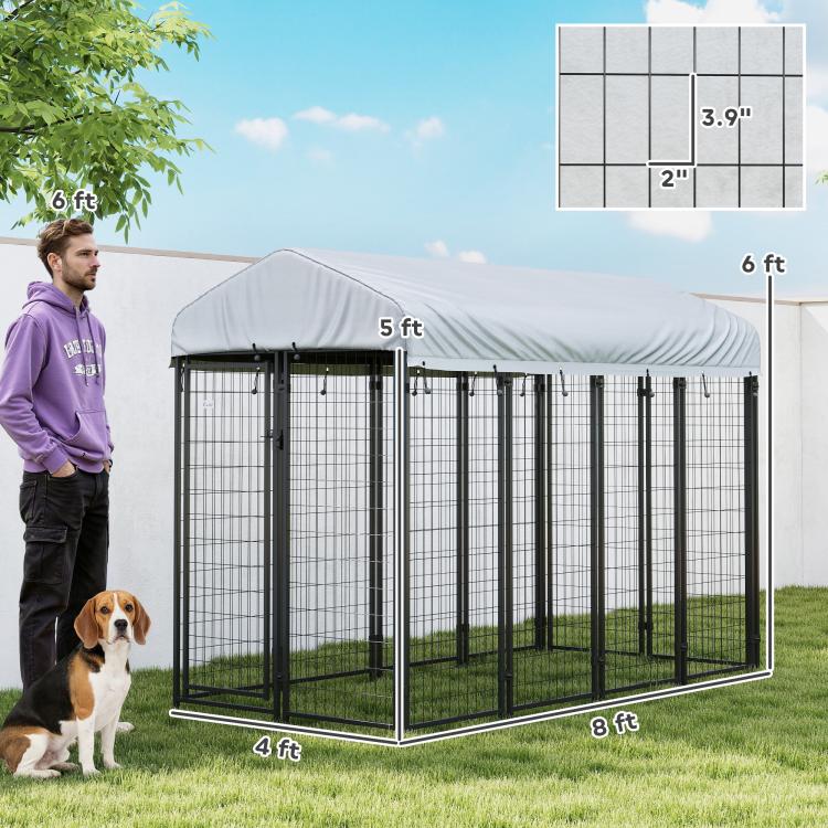 Outdoor dog kennel with gray cover and black wire frame, labeled dimensions view