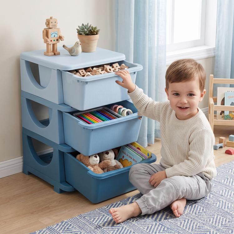 Blue 3-tier kids toy organizer with three open bins; child loading toys