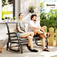 Outdoor glider bench with beige cushions; two people seated on the loveseat