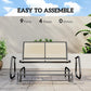 Beige outdoor glider bench, front view with two back panels and dark steel base