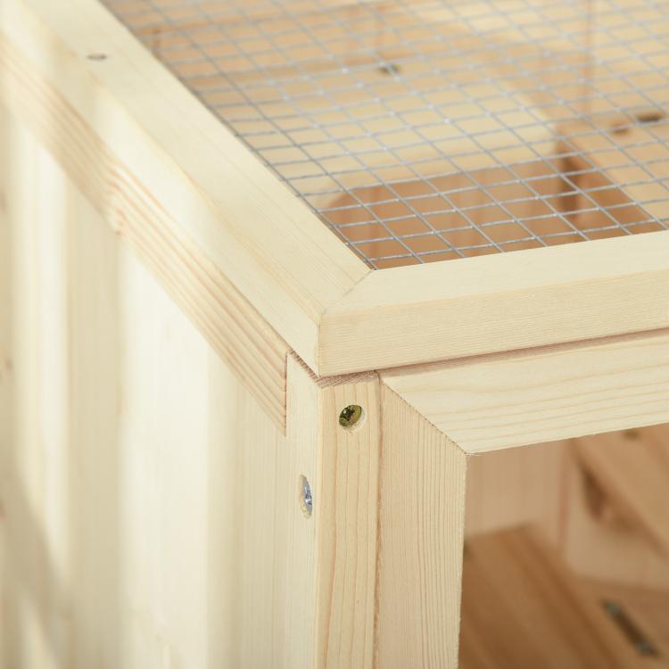 Close-up of natural wooden corner joint with screws on small animal hutch