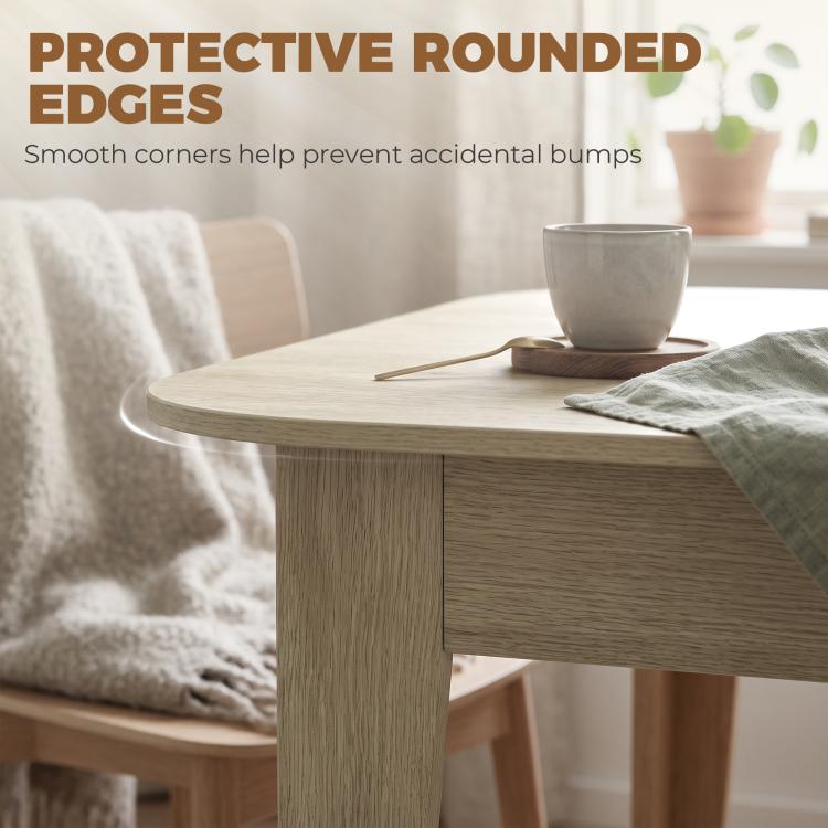 Light oak extendable oval dining table with rounded corners and sturdy pedestal base