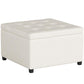 Beige padded storage ottoman with tufted top and short dark legs