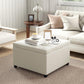 Beige square ottoman bench with button-tufted seat and padded sides, dark feet