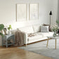 Light gray end table with storage drawer and bottom shelf next to sofa
