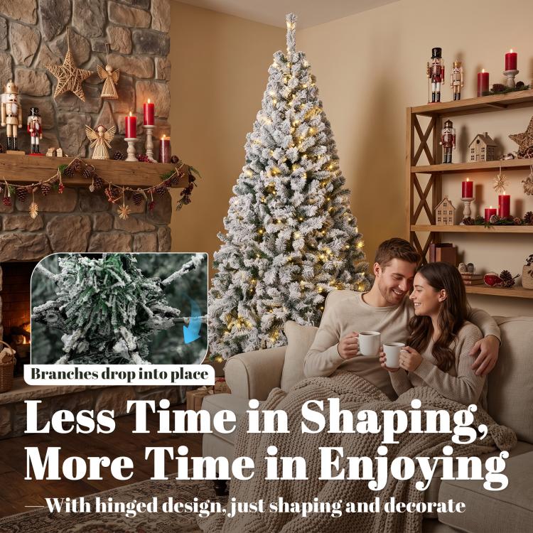 Snow-flocked prelit Christmas tree with warm white lights and hinged design