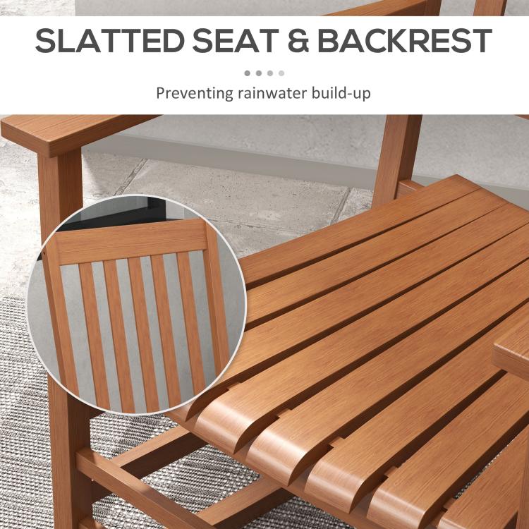 Close-up of brown slatted chair seat and backrest with smooth rocking frame
