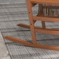 Close-up of brown rocking chair base with curved rockers and support frame