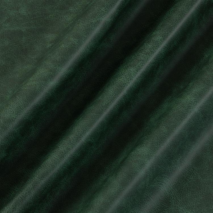Green PU leather upholstery close-up with fine grain texture