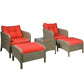 Set of two rattan wicker lounge chairs with red cushions and armrests