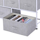 Light gray fabric storage cube dresser with five drawers, one open bin showing papers