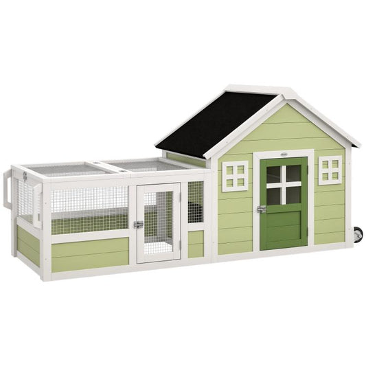 Rabbit hutch with green cottage-style house, white frame, and black roof